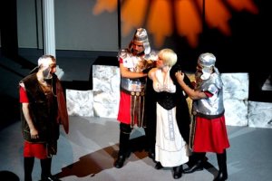 English Antigone (Eleni Rebecca) is arrested by the guards and Captain Jonas (Frank Cannizzo)